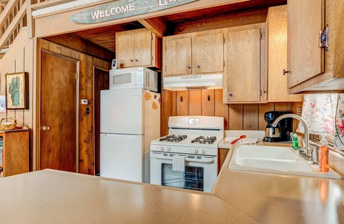 Sierra Tract House | Dog-friendly 2-story cabin with loft, fireplace, board games, & wooded views