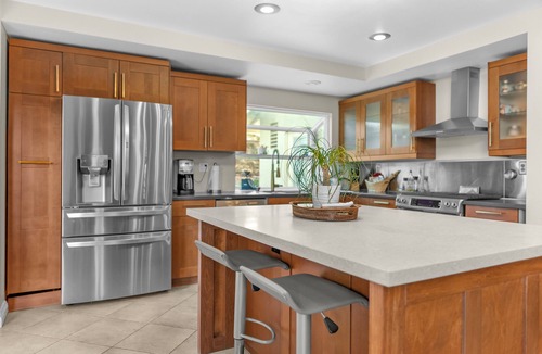 Corona House | Enjoy a comfortable 3-bedroom home in Corona featuring a private pool with a waterslide, outdoor kitchen, fire pit, and dedicated workspaces. Designed for 30+ day stays, this home is ideal for relocation guests, insurance housing, corporate travelers
