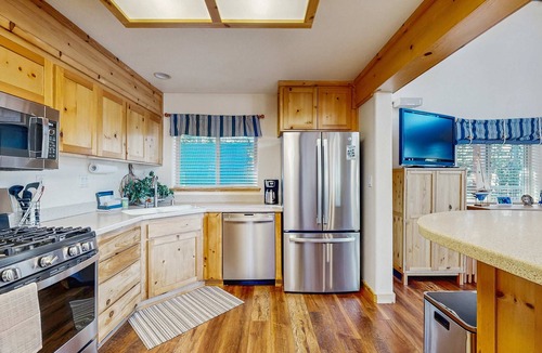 Serene Lakes House | Family-friendly, lakefront getaway with a gas fireplace, furnished deck, & views