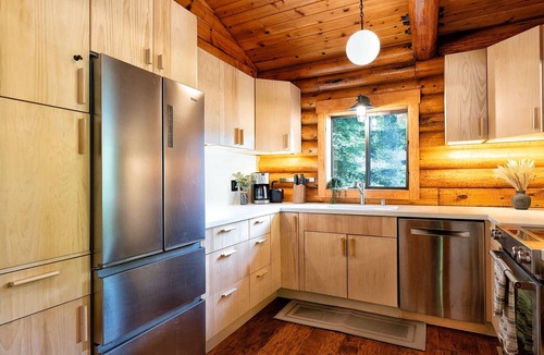 Northwood Cabin | Riverfront cabin, hot tub, private dock, redwoods, ping-pong, foosball