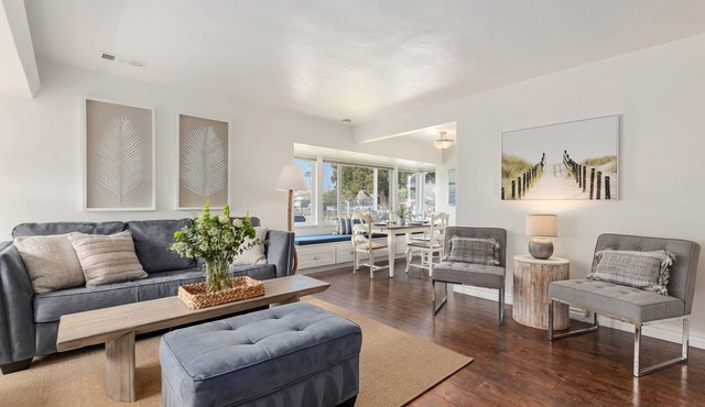 Bright and Airy Coastal Condo Just a Half Block Away From East Beach!