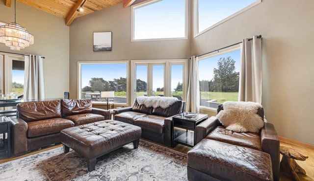 Enjoy a private hot tub, deck, distant ocean view & fireplace