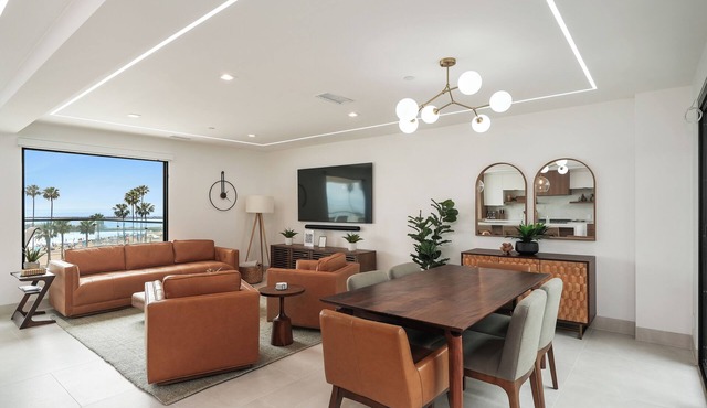 Experience a luxurious 4-bedroom, 4.5-bath mid-century modern coastal escape in Corona Del Mar, CA. Steps from the Pacific Ocean, this fully remodeled home features a gourmet kitchen, private hot tub, sauna, and Cntrl4 system. Comfortably fits 10