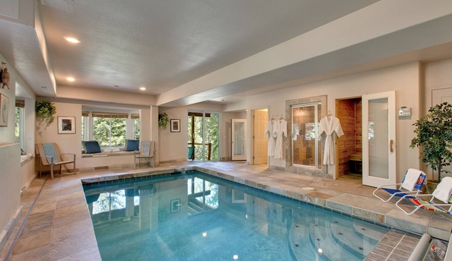 Indoor heated pool, spacious deck, seven rooms with beds, hot tub, and more!