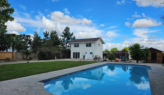 Spacious 2 story gated home w/pool & play area.